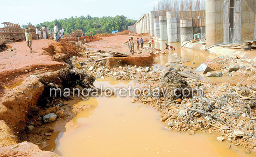 Surge in river water washes away construction equipment